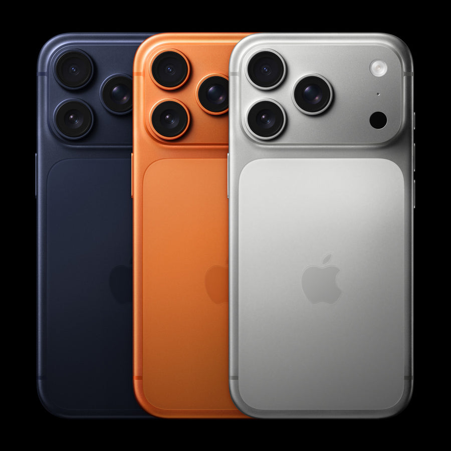 Three iPhone models in black, orange, and silver on a black background